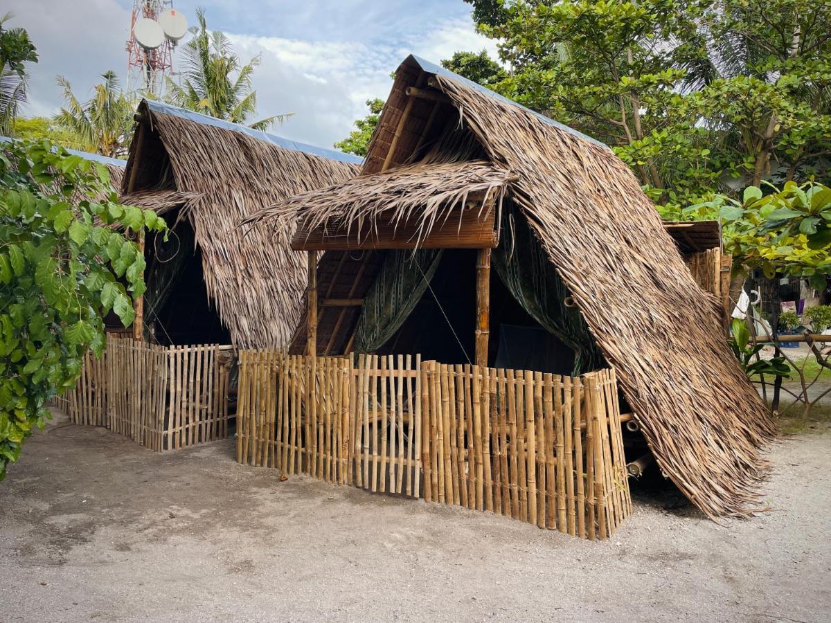 Хостел Tribal Huts Community Daanbantayan Экстерьер фото