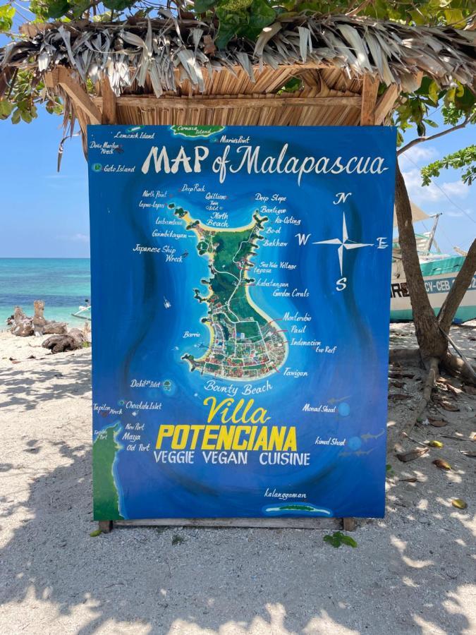 Хостел Tribal Huts Community Daanbantayan Экстерьер фото